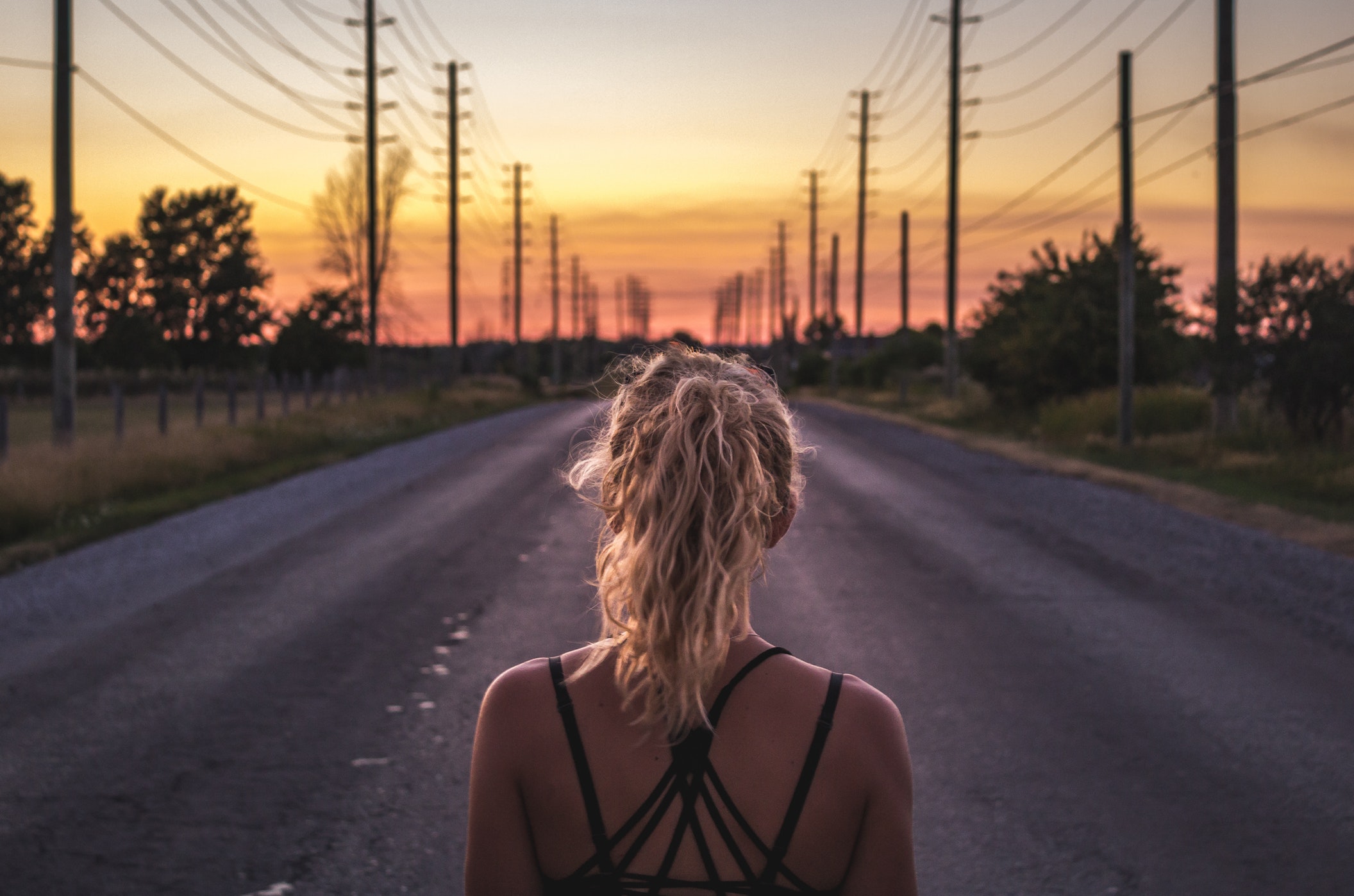 Girl on a road preparing to run